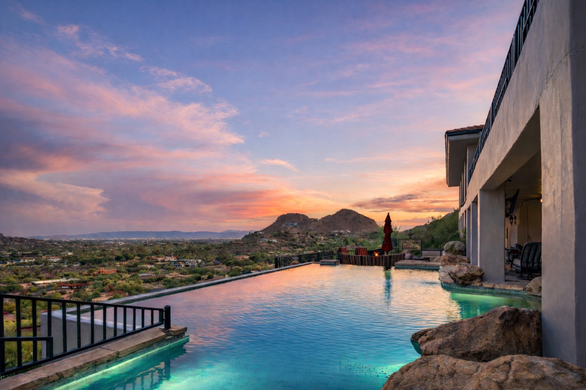 Infinity pool at sunset overlooking the valley